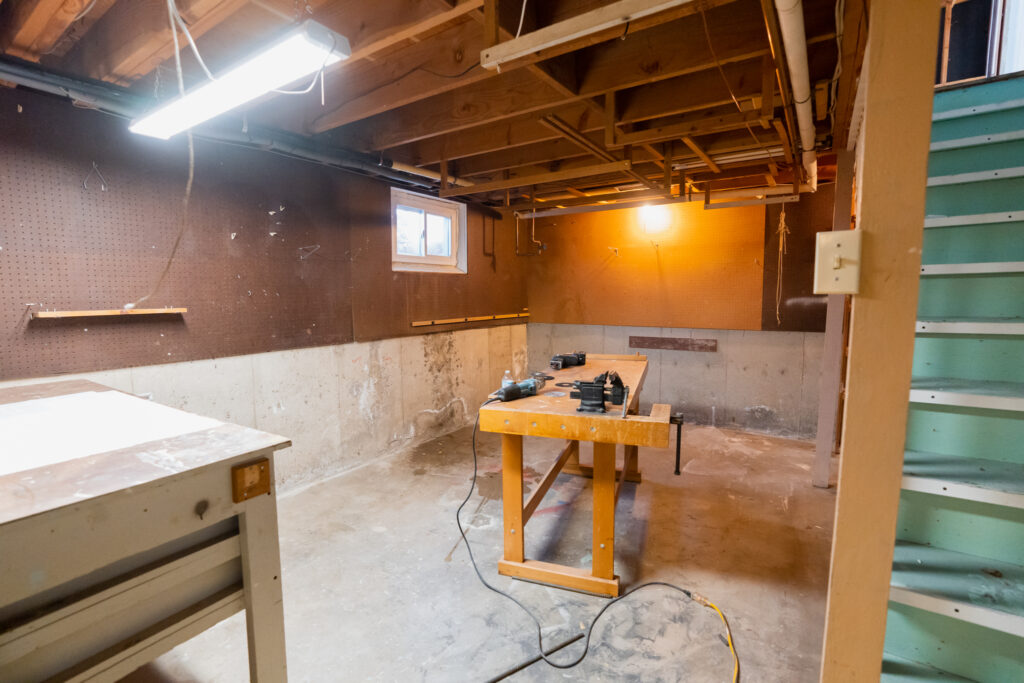 Unfinished basement before a full basement remodel, part of a complete home renovation in Boulder, CO.