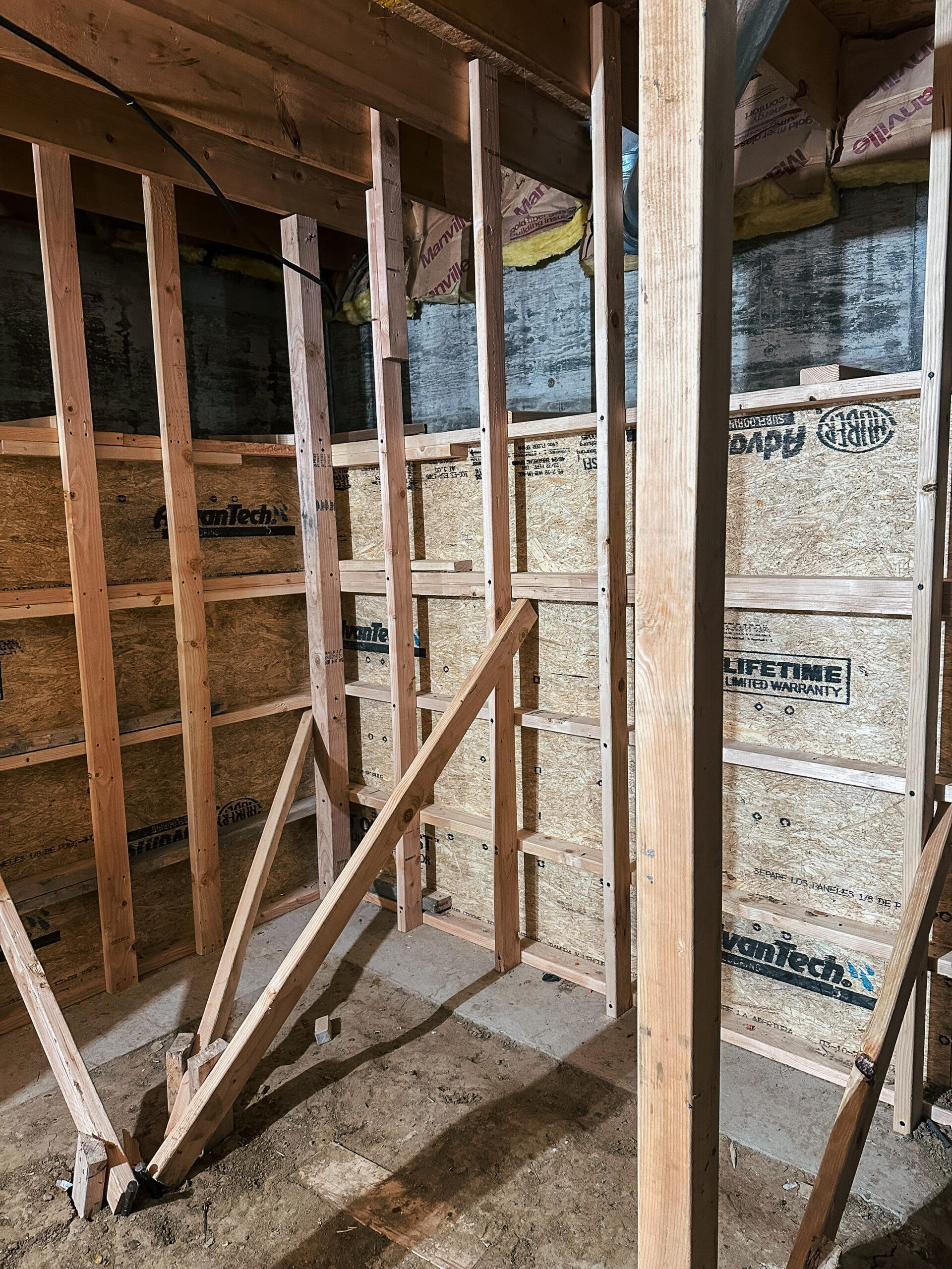 Wall forms forming the concrete walls in a crawl space to basement conversion in Denver.