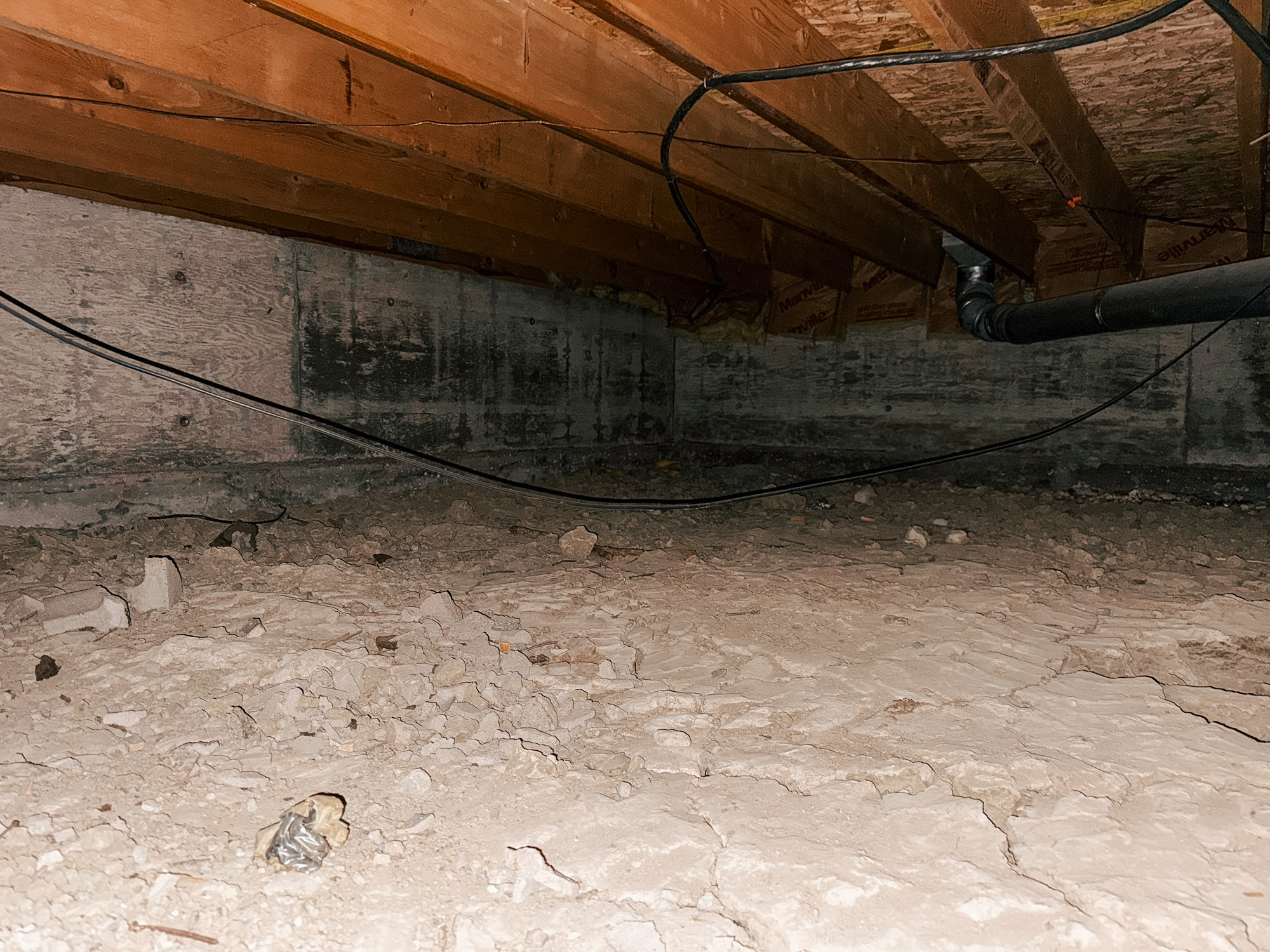 Crawl space area before a crawl space to basement conversion.