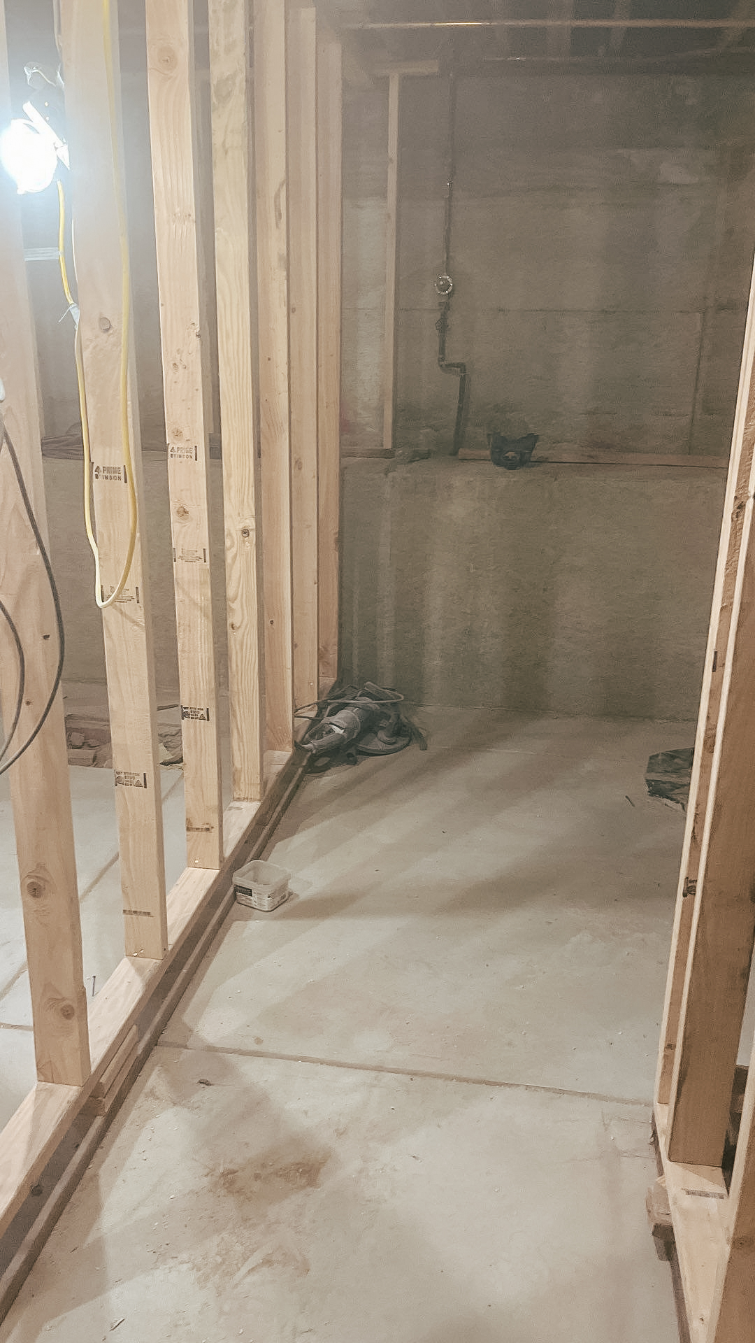 Concrete is poured for a finished basement after a crawl space dig out.